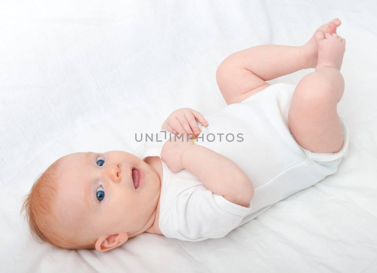 Newborn Baby Lying on Back on White Background