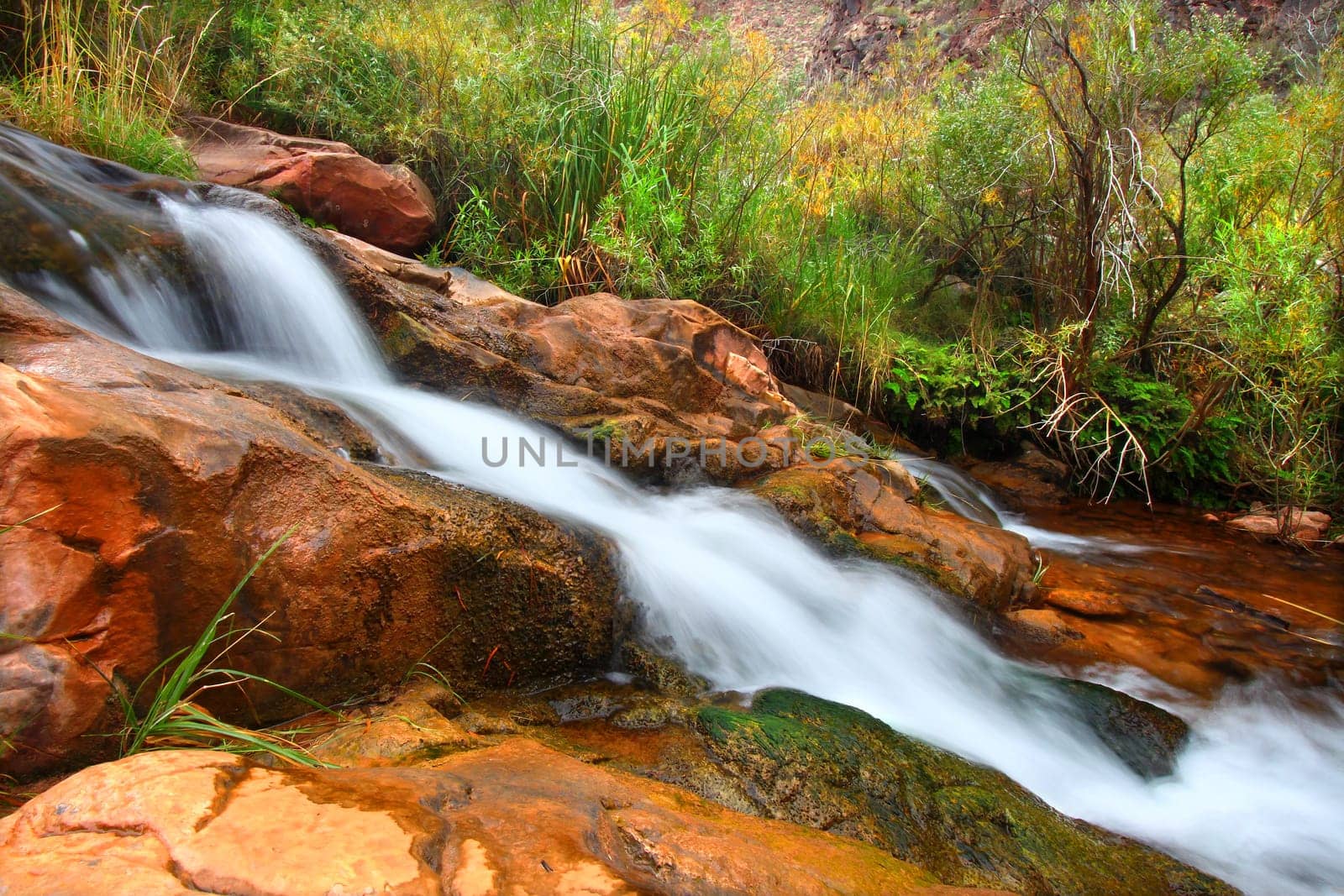 Cascades of a small stream flowing through Grand Canyon National Park on its way to the Colorado River.