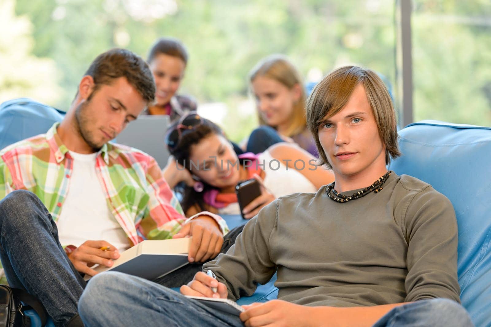 High-school students in study room reading writing young