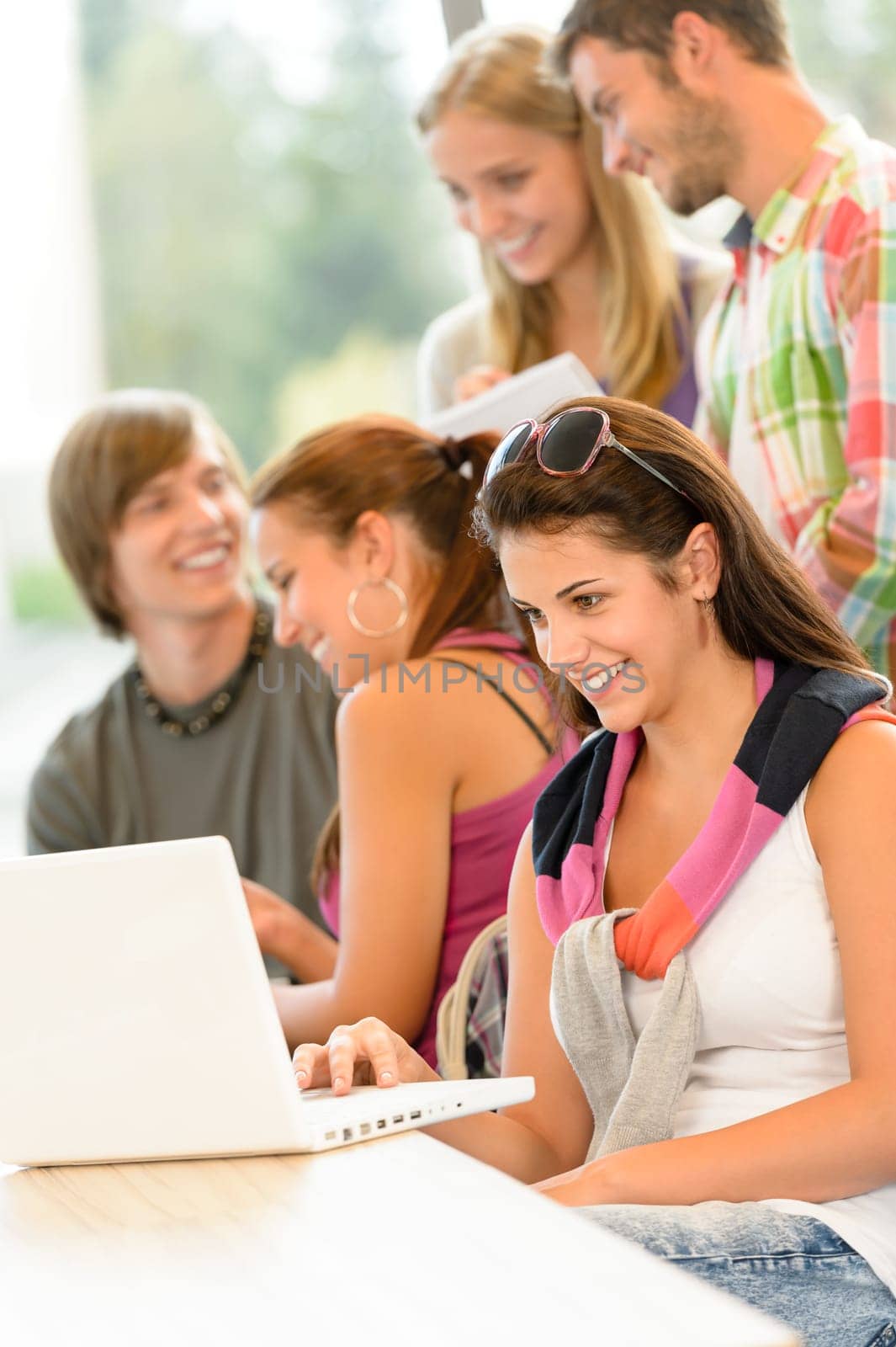 High-school study group learning in library class students teen smiling