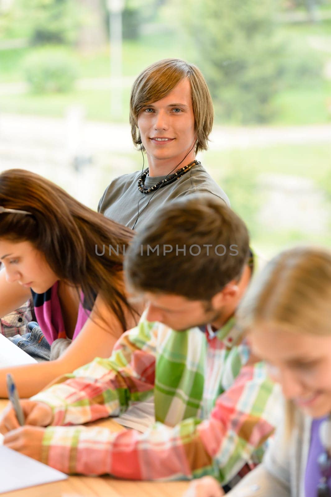High-school students at lesson in class teens college writing young