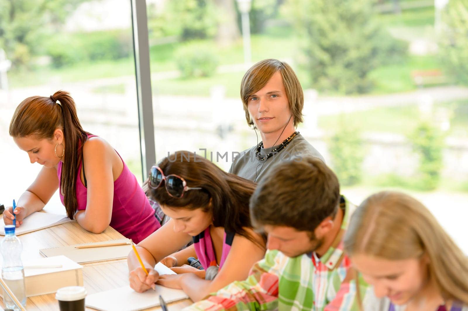High-school students at lesson in class teens college writing young