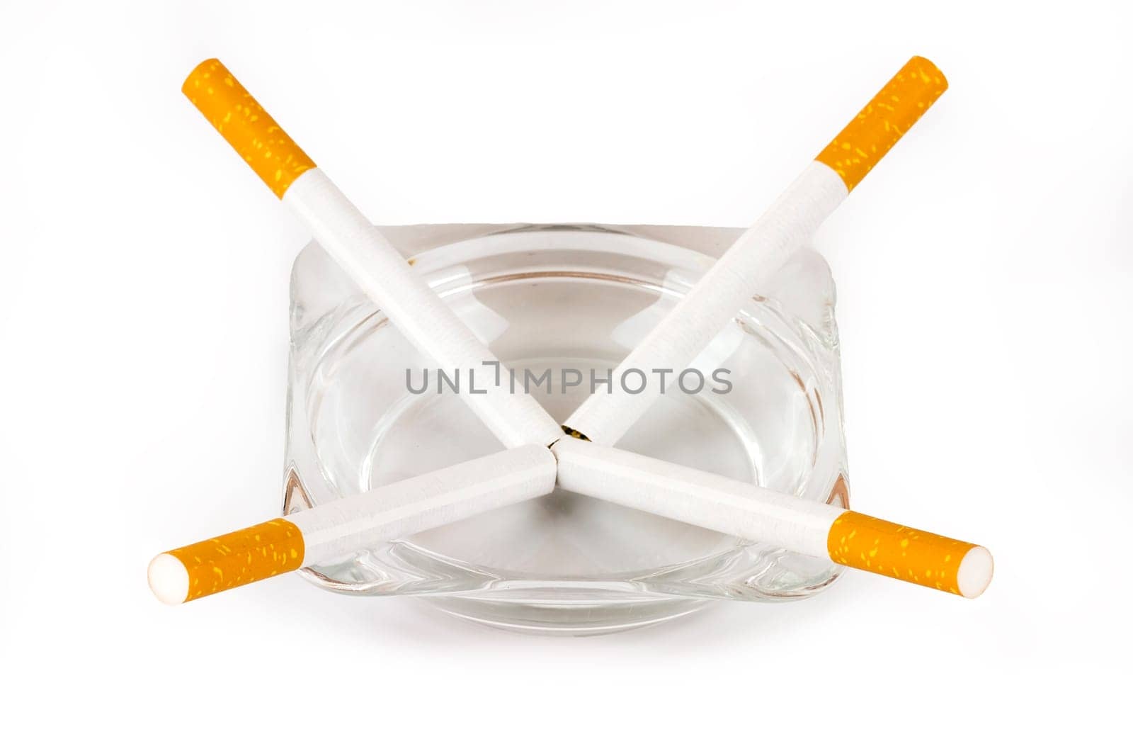 Color photo of filter cigarettes isolated background in an ashtray