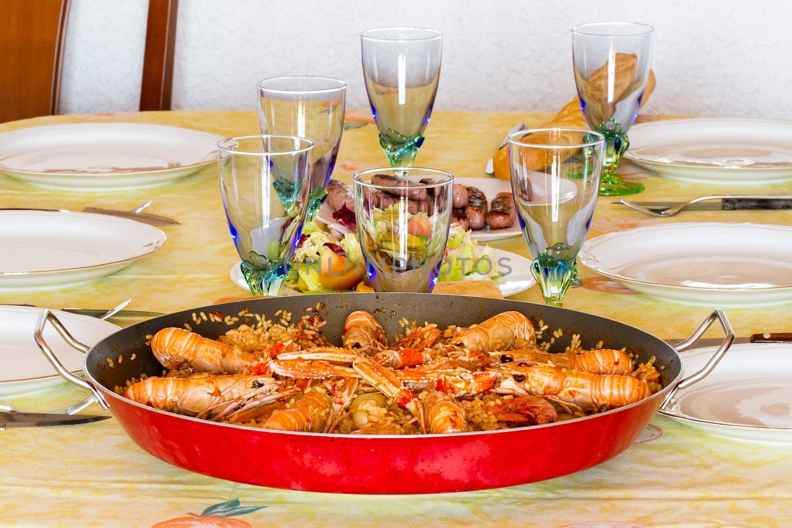 traditional spanish paella with prawn on big pan