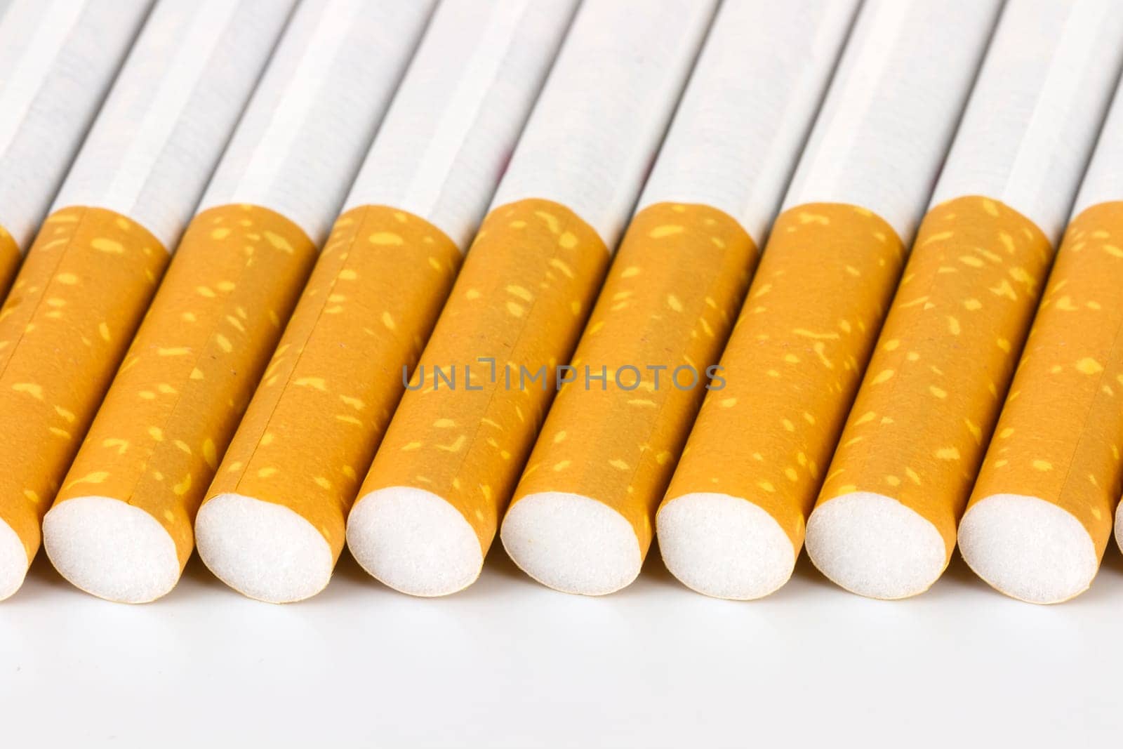 Color photo of filter cigarettes isolated background aligned by the filter