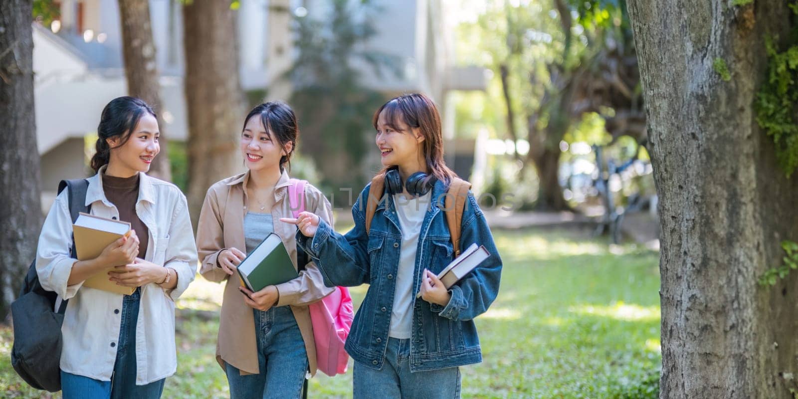 Student university friendship concept with classmate walking together at campus college park. Youth teenage and education.