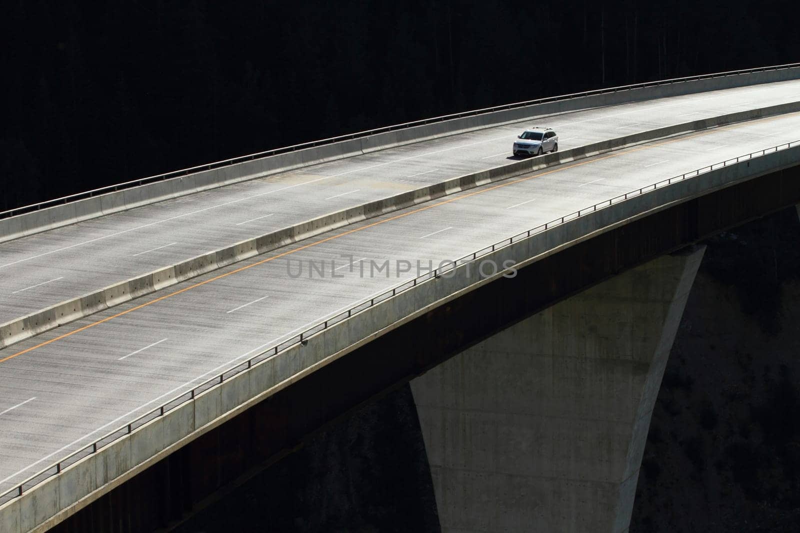 Single car crossing a high level bridge in British Columbia