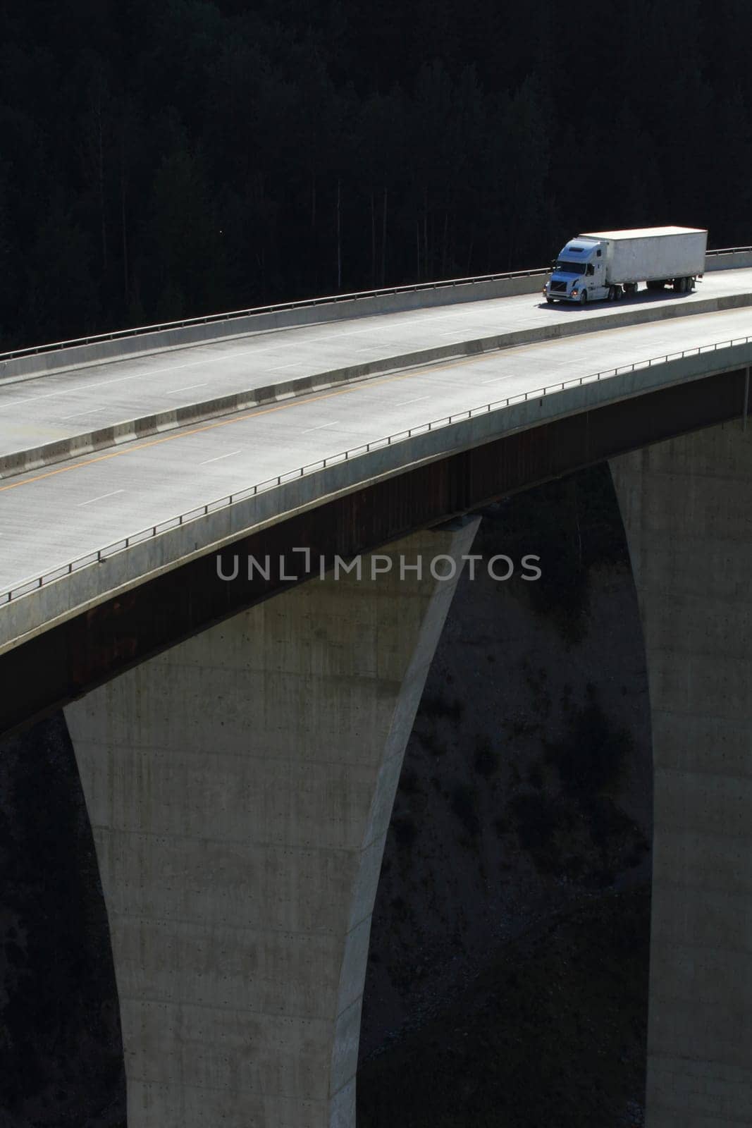 Semi-trailer truck crossing a high level bridge in British Columbia