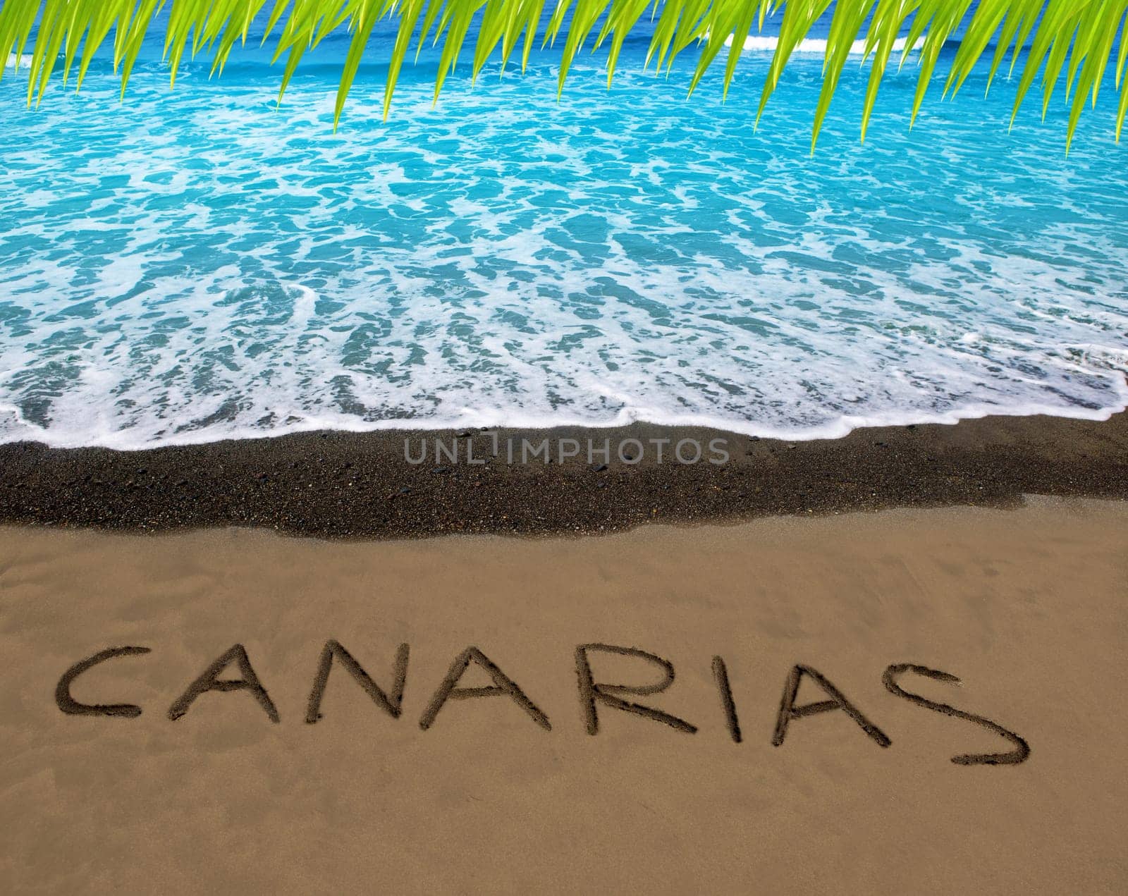 Brown beach sand with written word Canarias in Canary islands