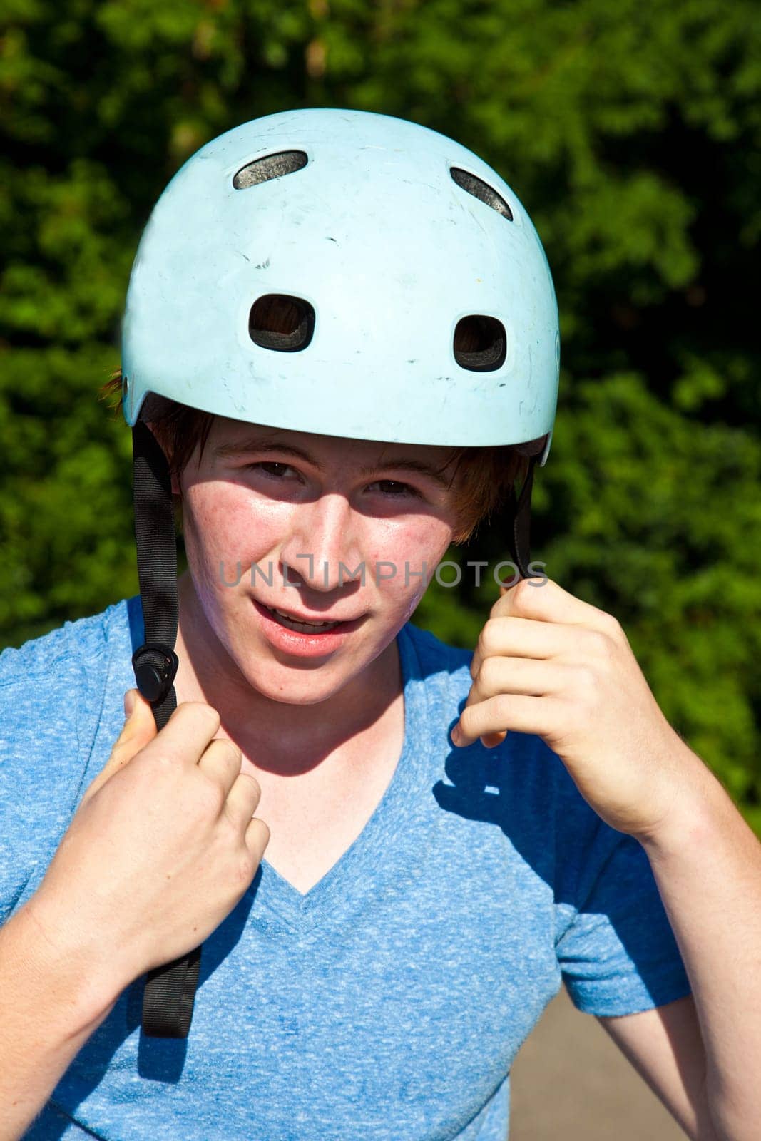 portrait of cute boy with helmet in the nature