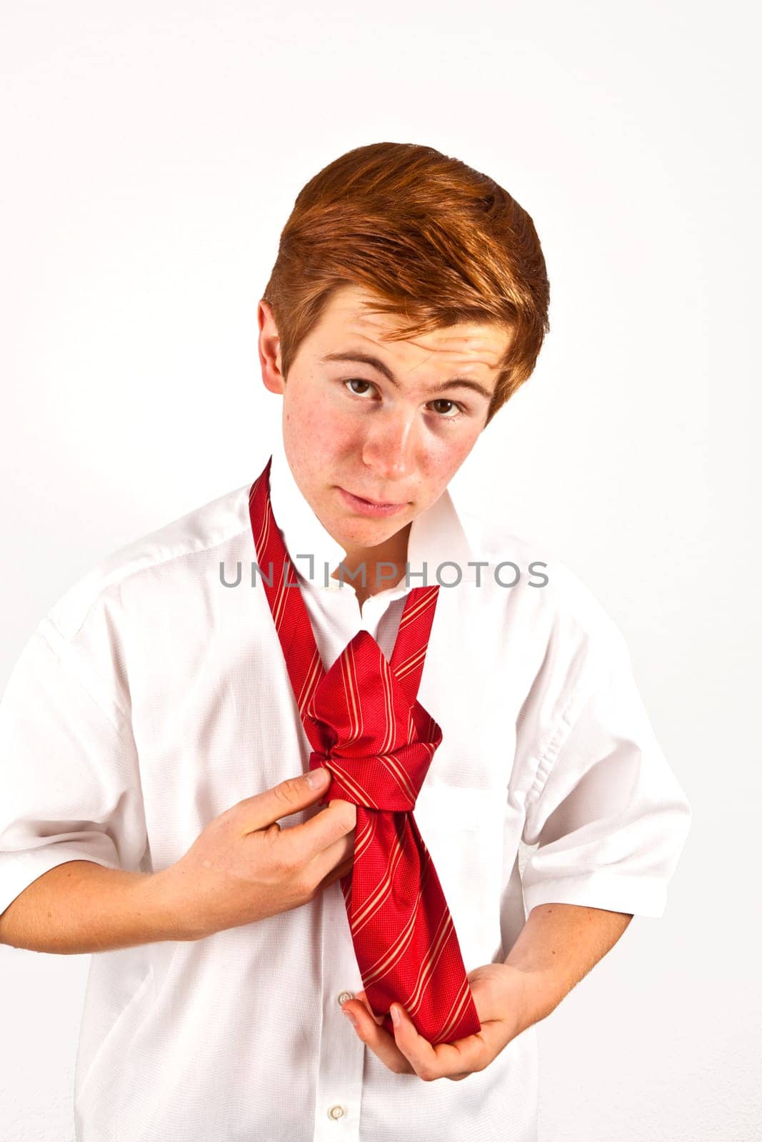 attractive  teenager  binding his tie