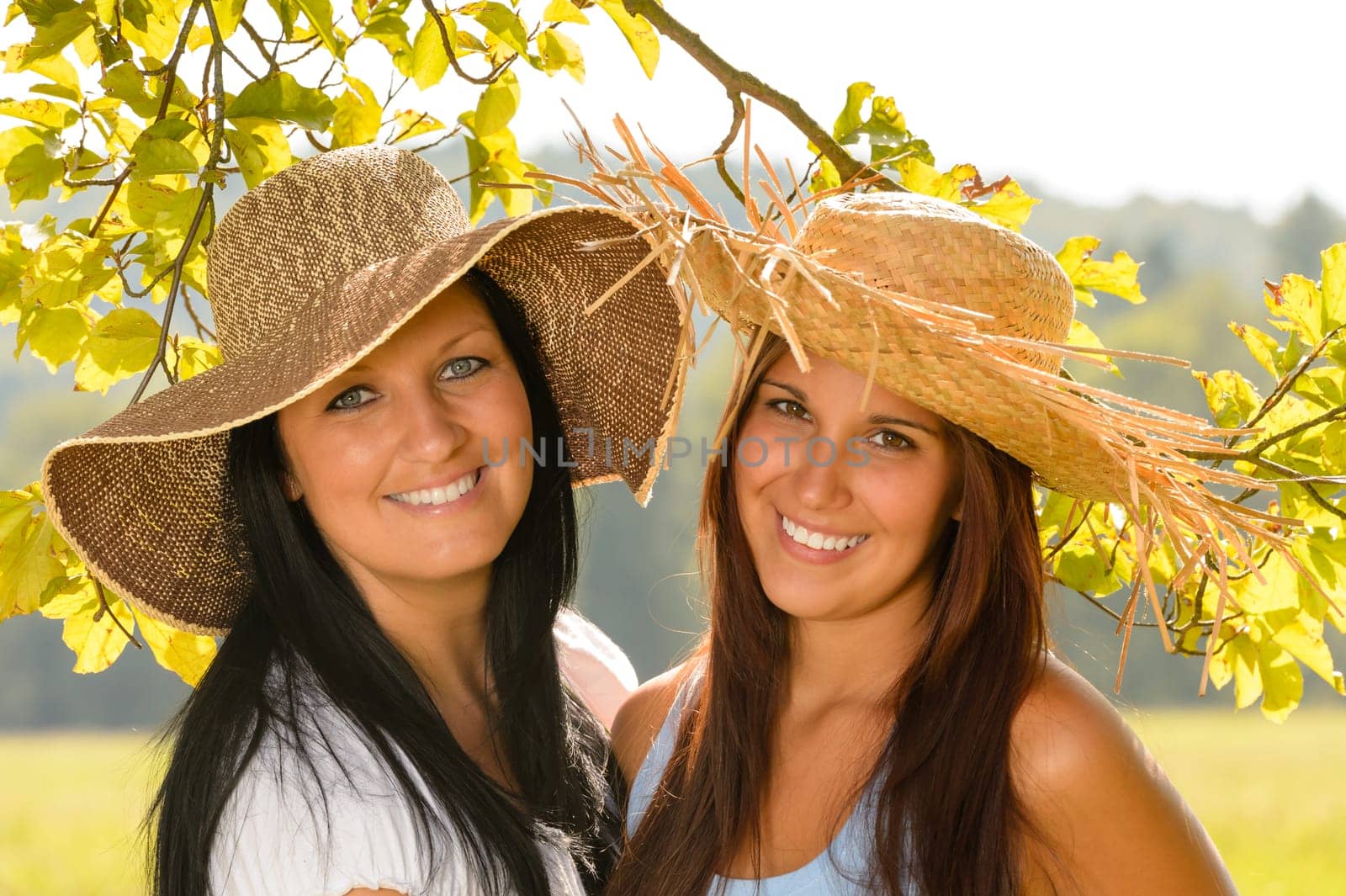Mother and teen daughter relaxing outdoors happy summer bonding vacation