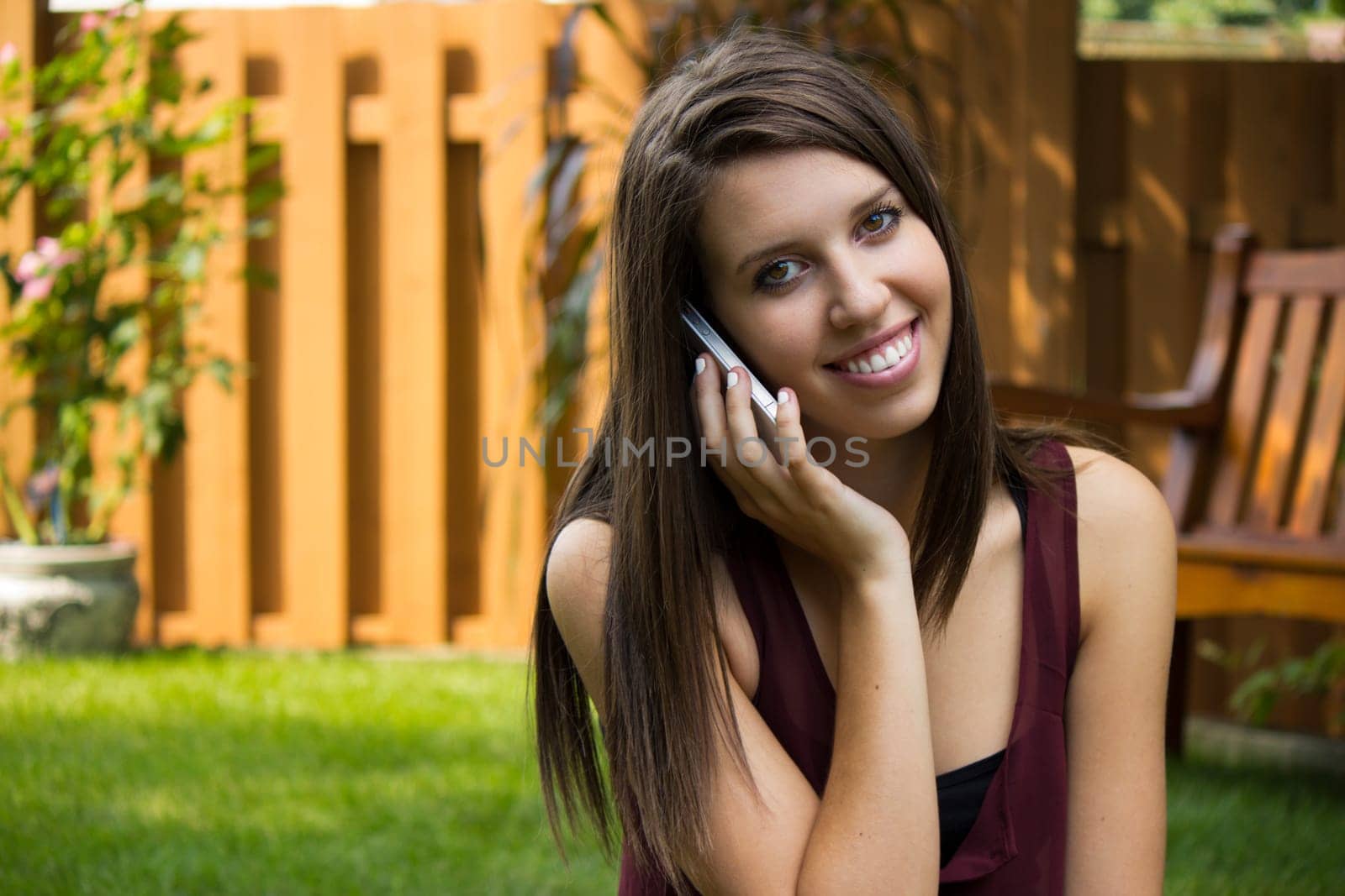 A pretty girl talks on her mobile phone.