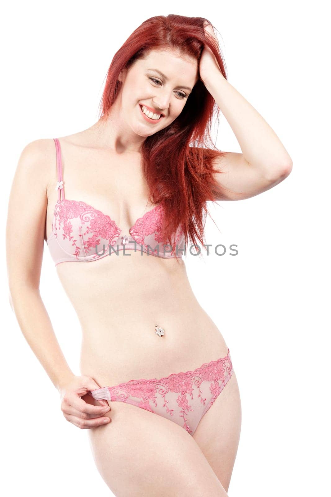 Attractive young woman in her underwear posing and having fun