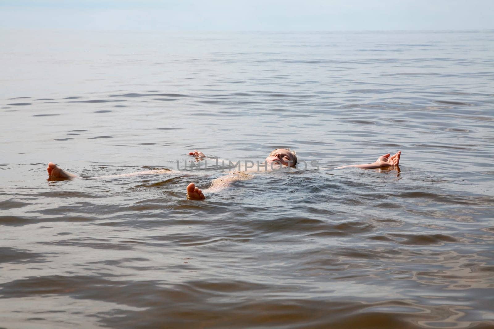 Boy bathing in the sea