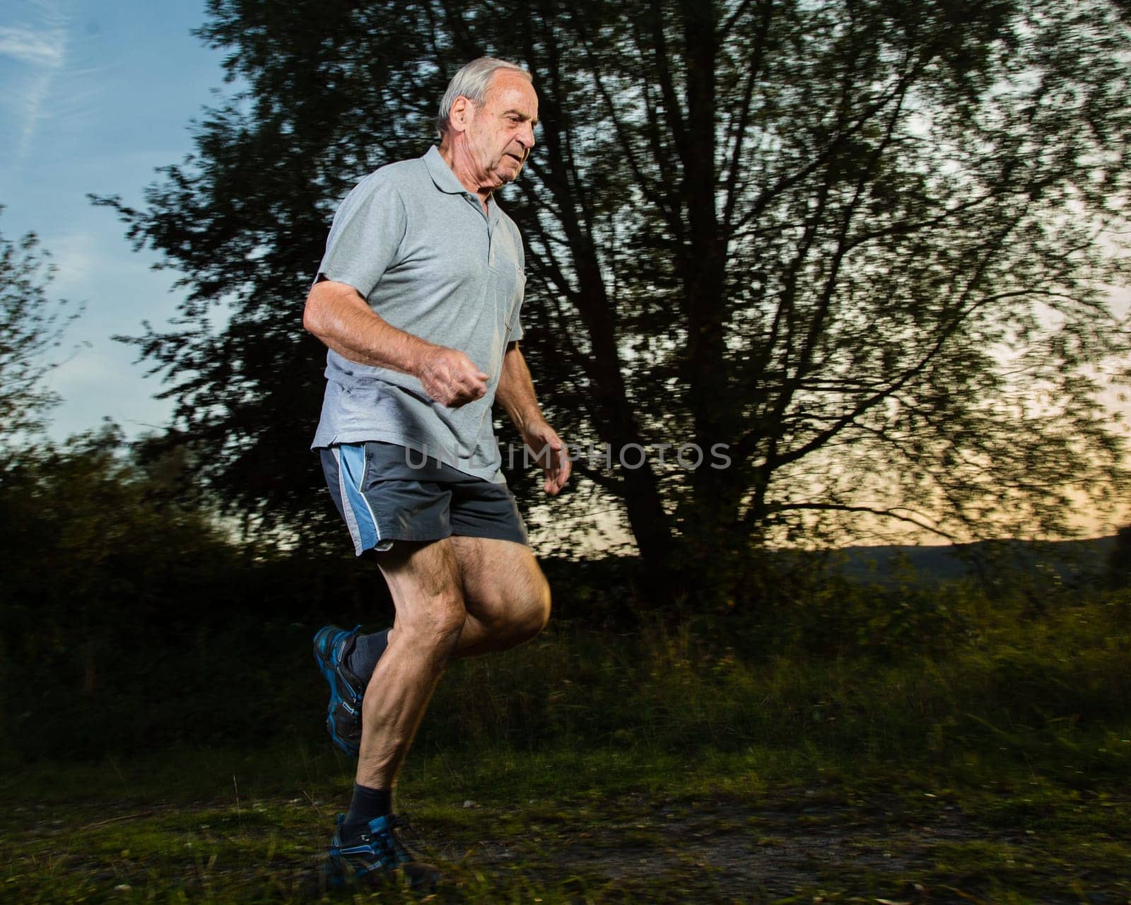 Senior jogging before sunset