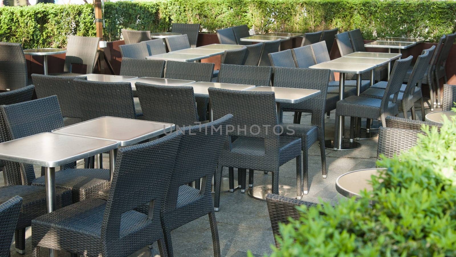 Empty little tables of street cafe a close up