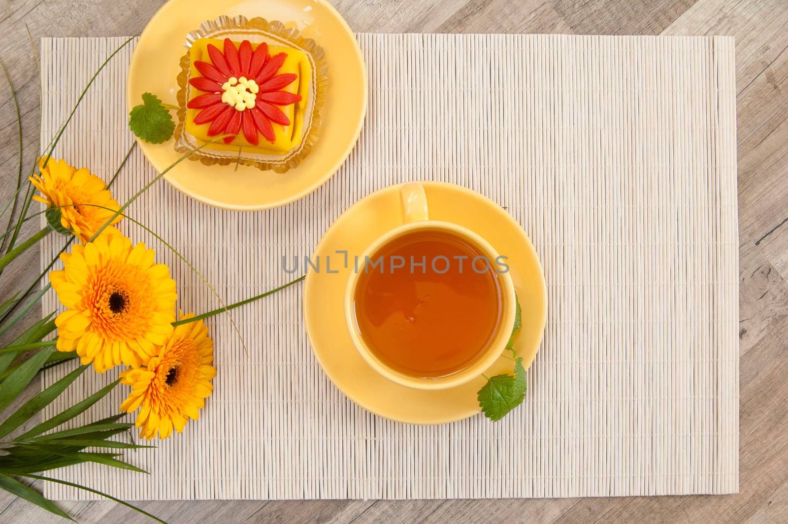 tea with cake and gerberas flowers