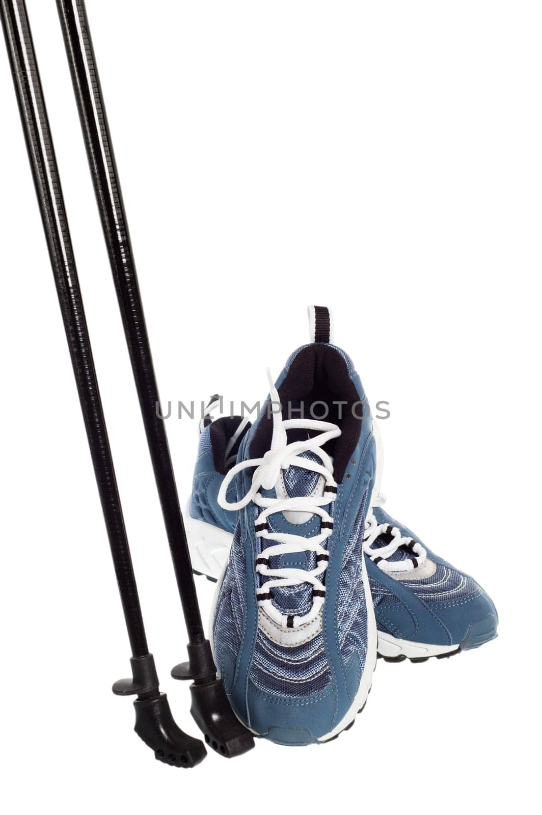 sticks for Nordic walking and  sports shoes  isolated on white
