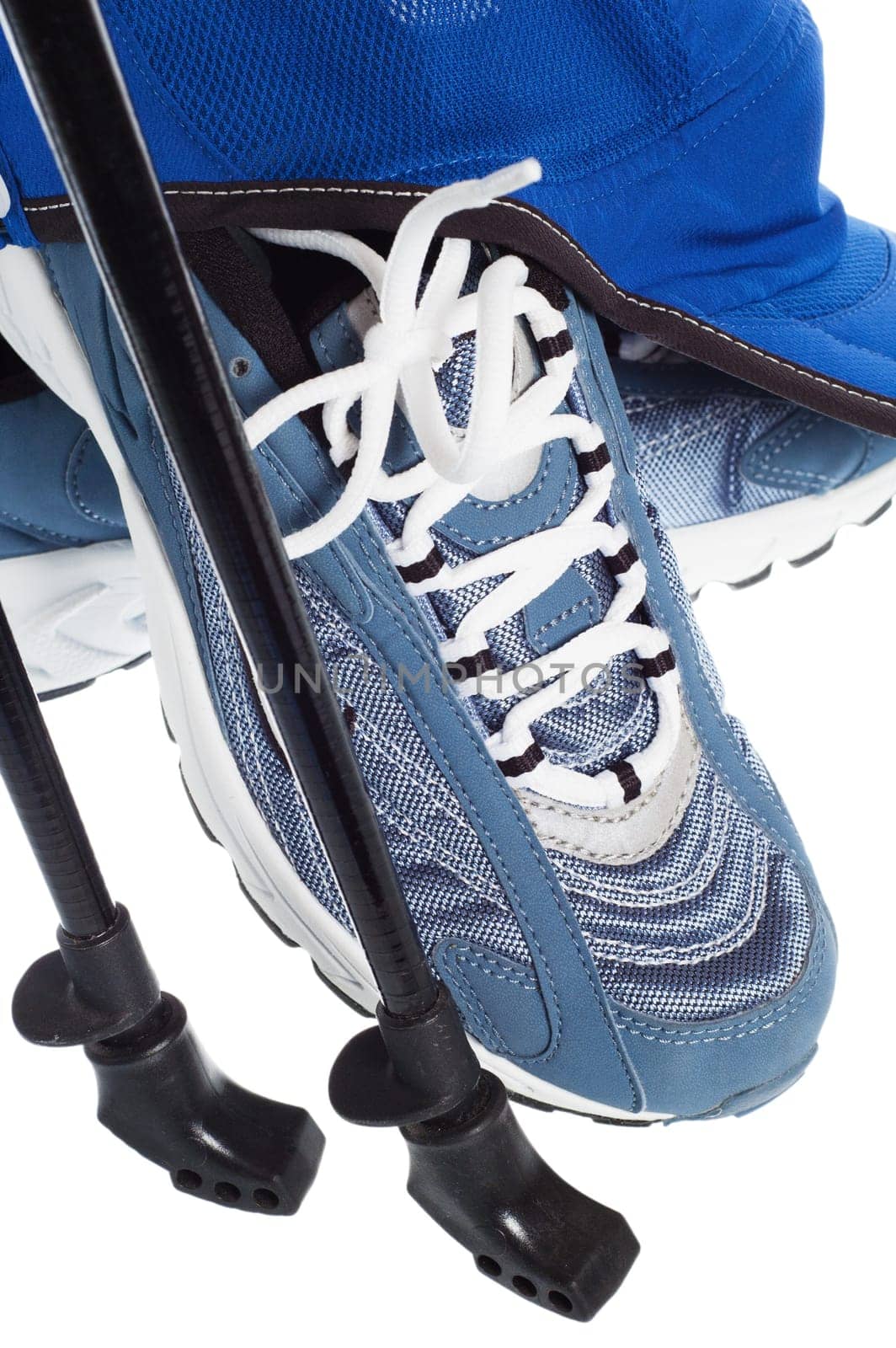sticks for Nordic walking and  sports shoes  isolated on white