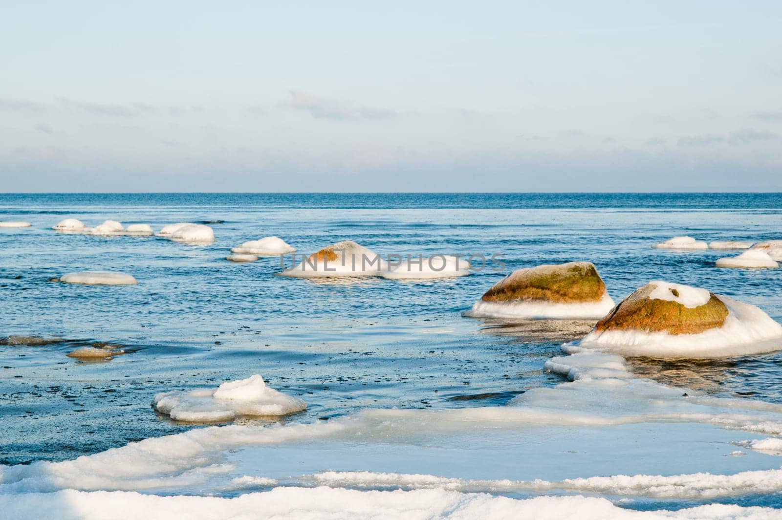 ice-covered stones along the shores of the Baltic Sea
