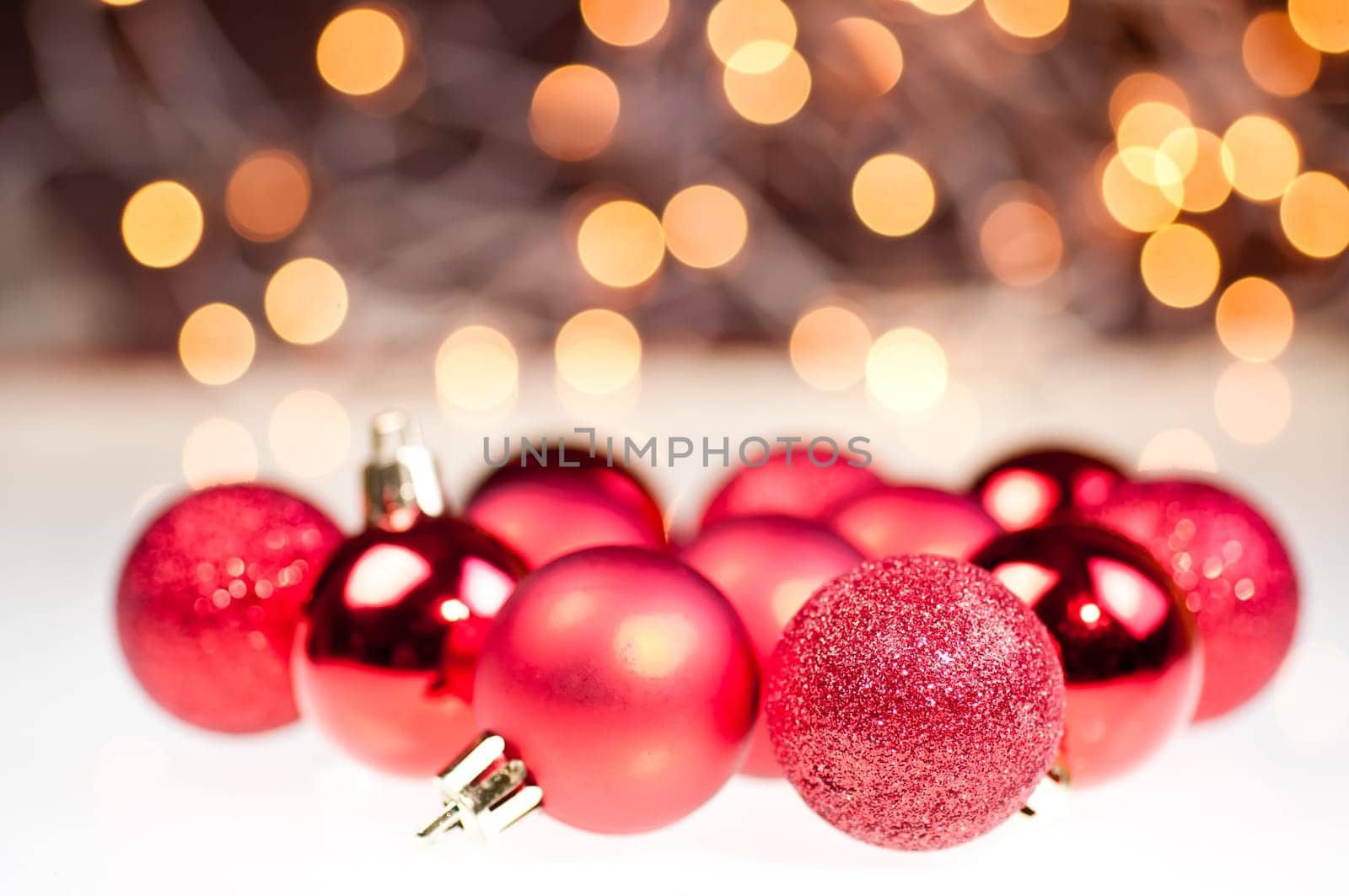 Three different design of red Christmas baubles