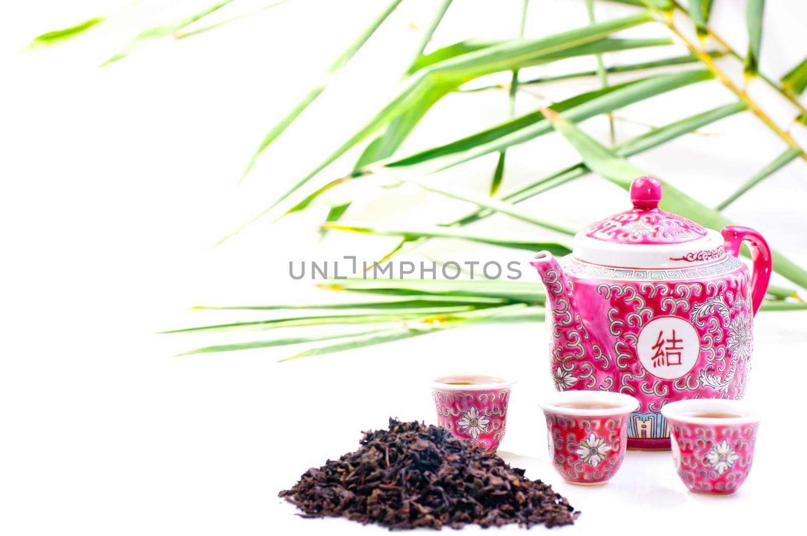 Porcelain Chinese tea set with a bamboo background