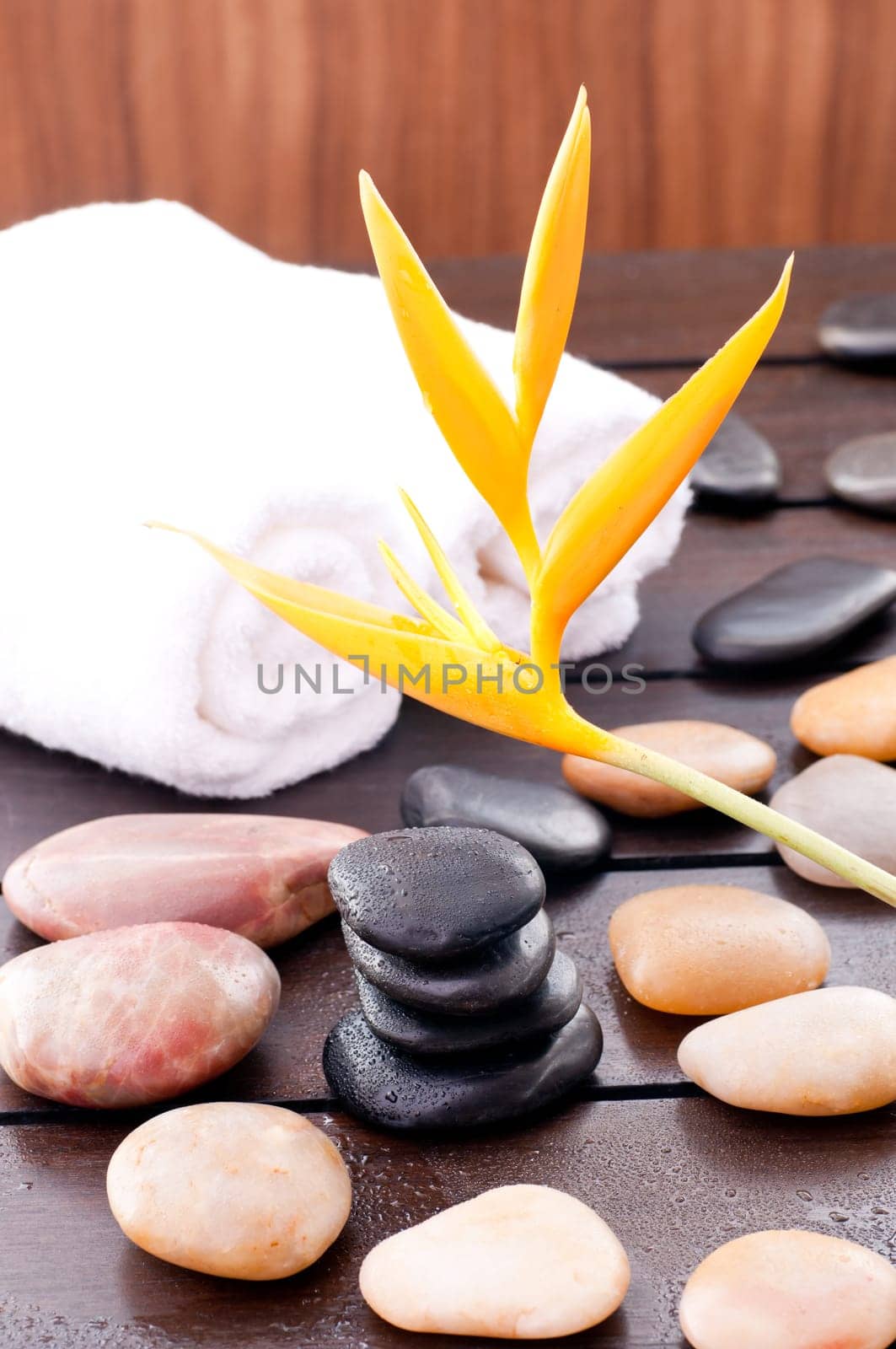 Zen stones on a wooden table outdoor with resort feel