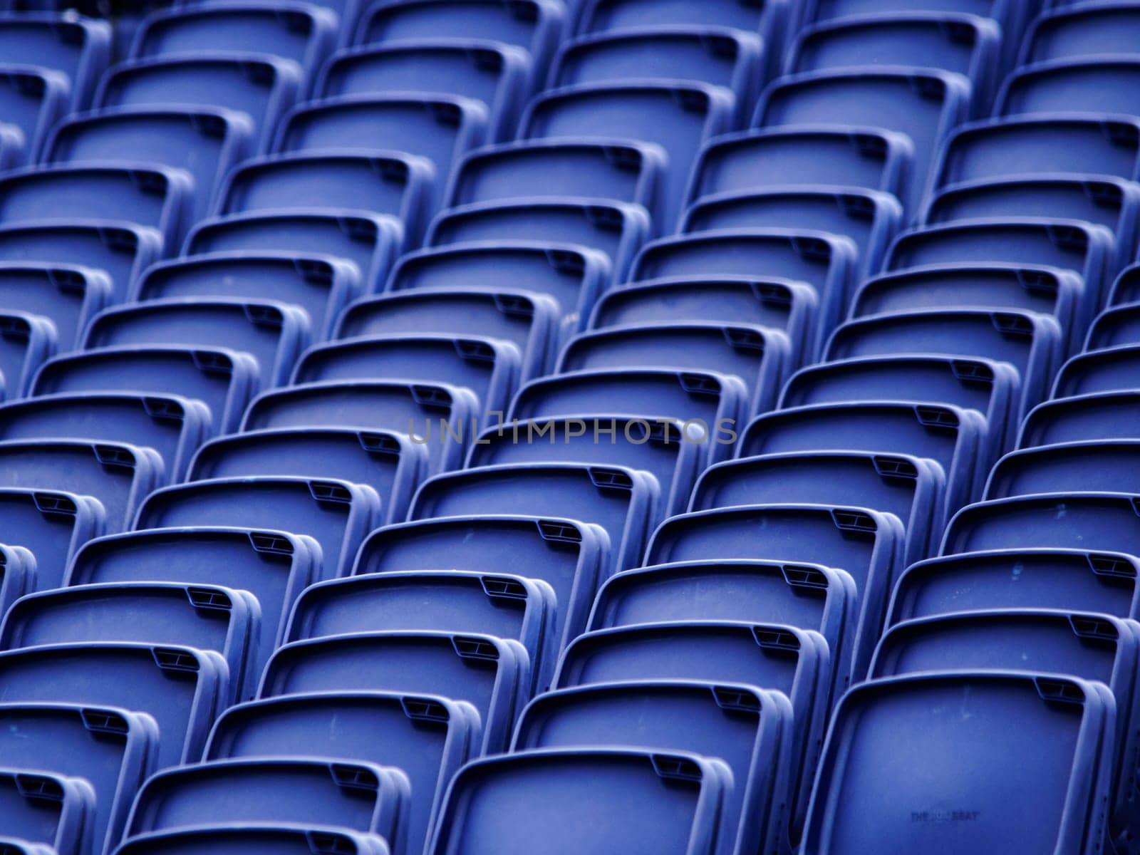 Empty plastic seats in a tribune