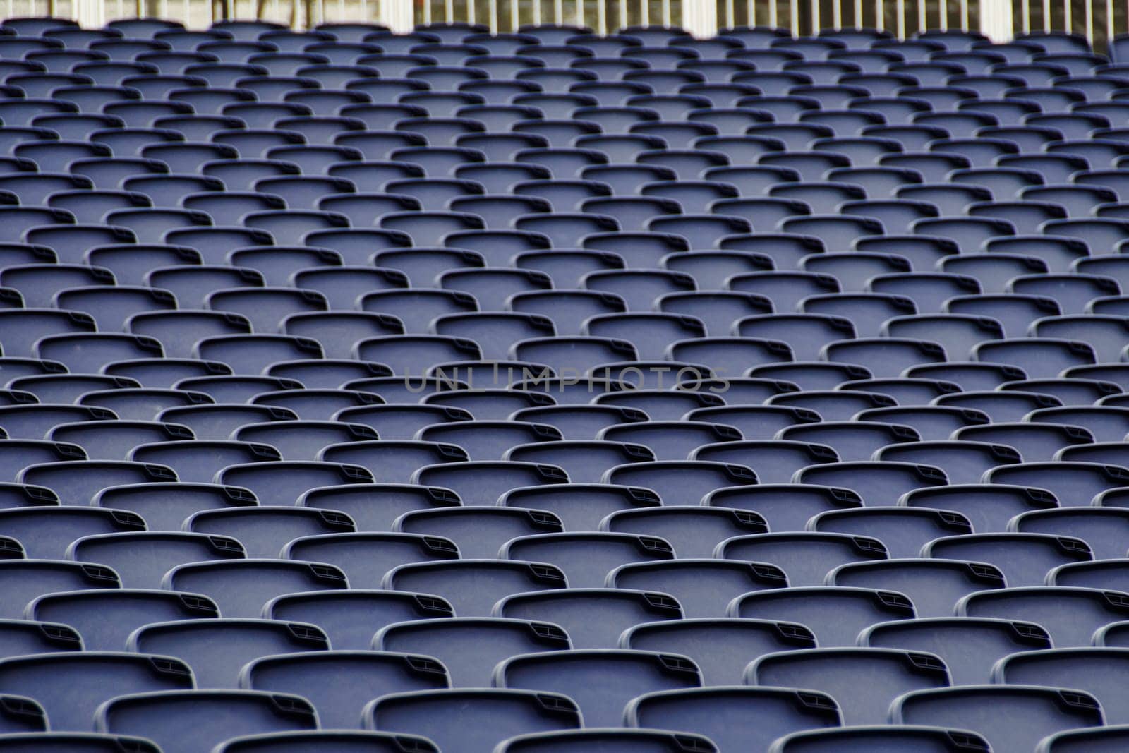 Empty plastic seats in a tribune