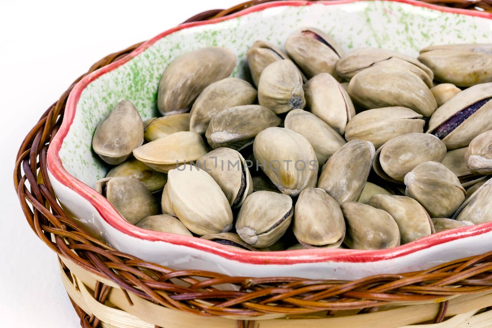 A heap of savory pistachio isolated on white background