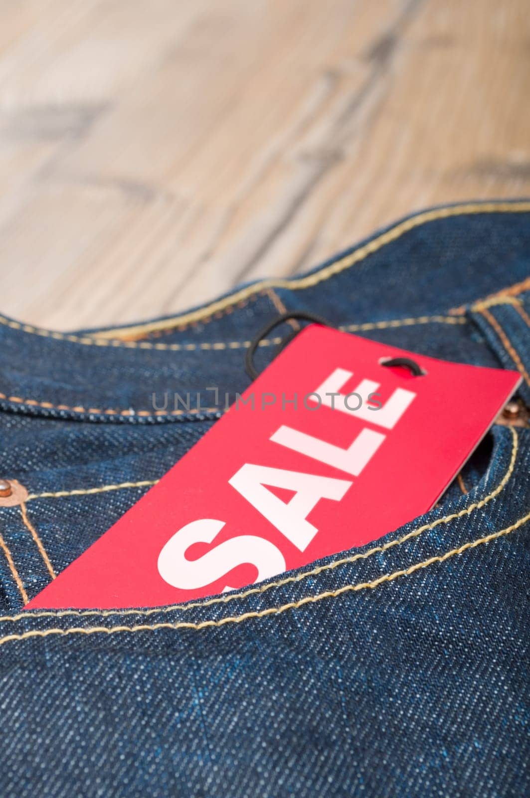 Red Sale Tag in Pocket of Blue Jeans