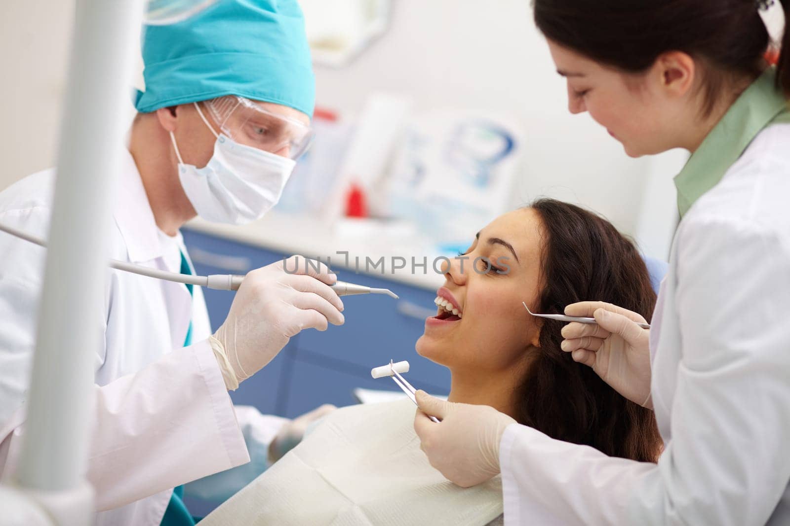 Pretty patient undergoing a dental check