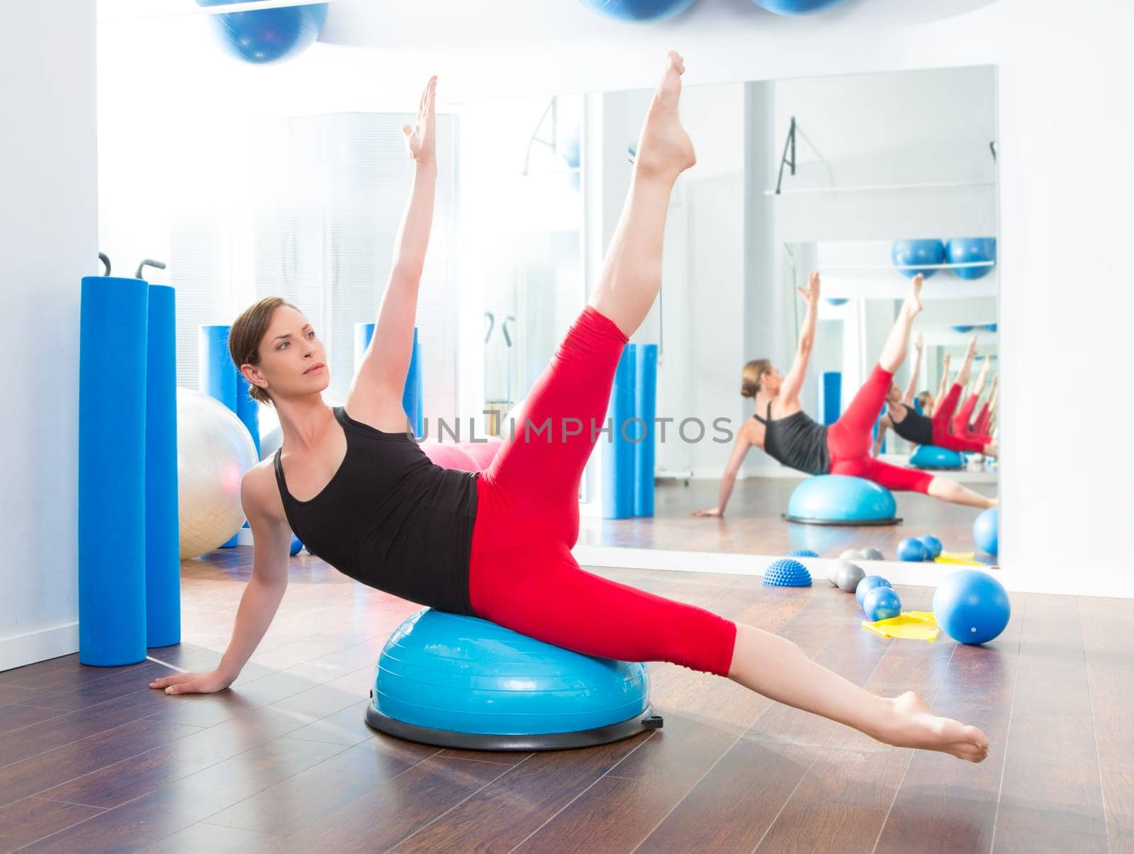 Bosu ball for fitness instructor woman in aerobics gym