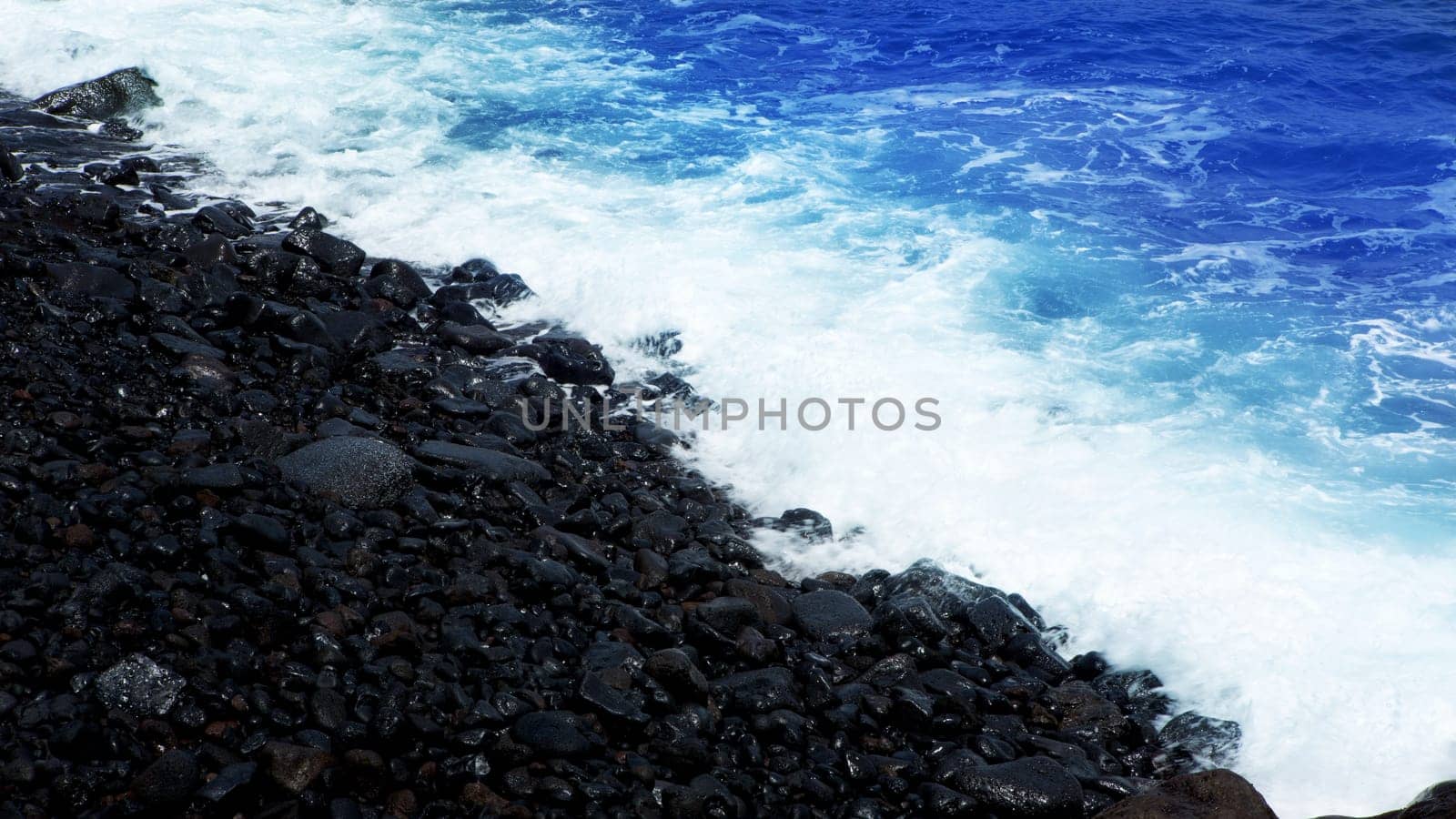 Atlantic volcanic black coast in la Palma with foam in funecaliente Canary Islands