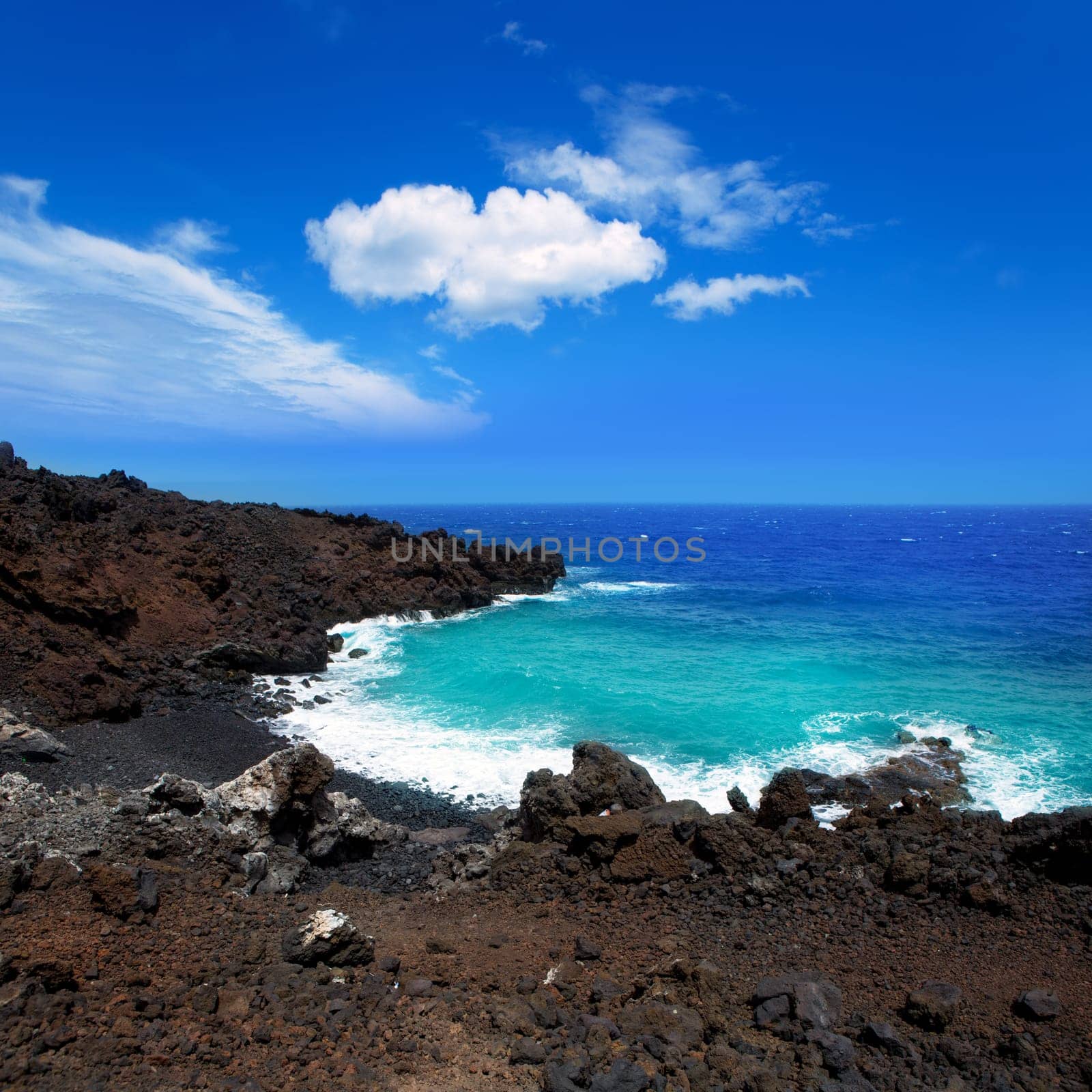 Atlantic volcanic black coast in la Palma with foam in funecaliente Canary Islands