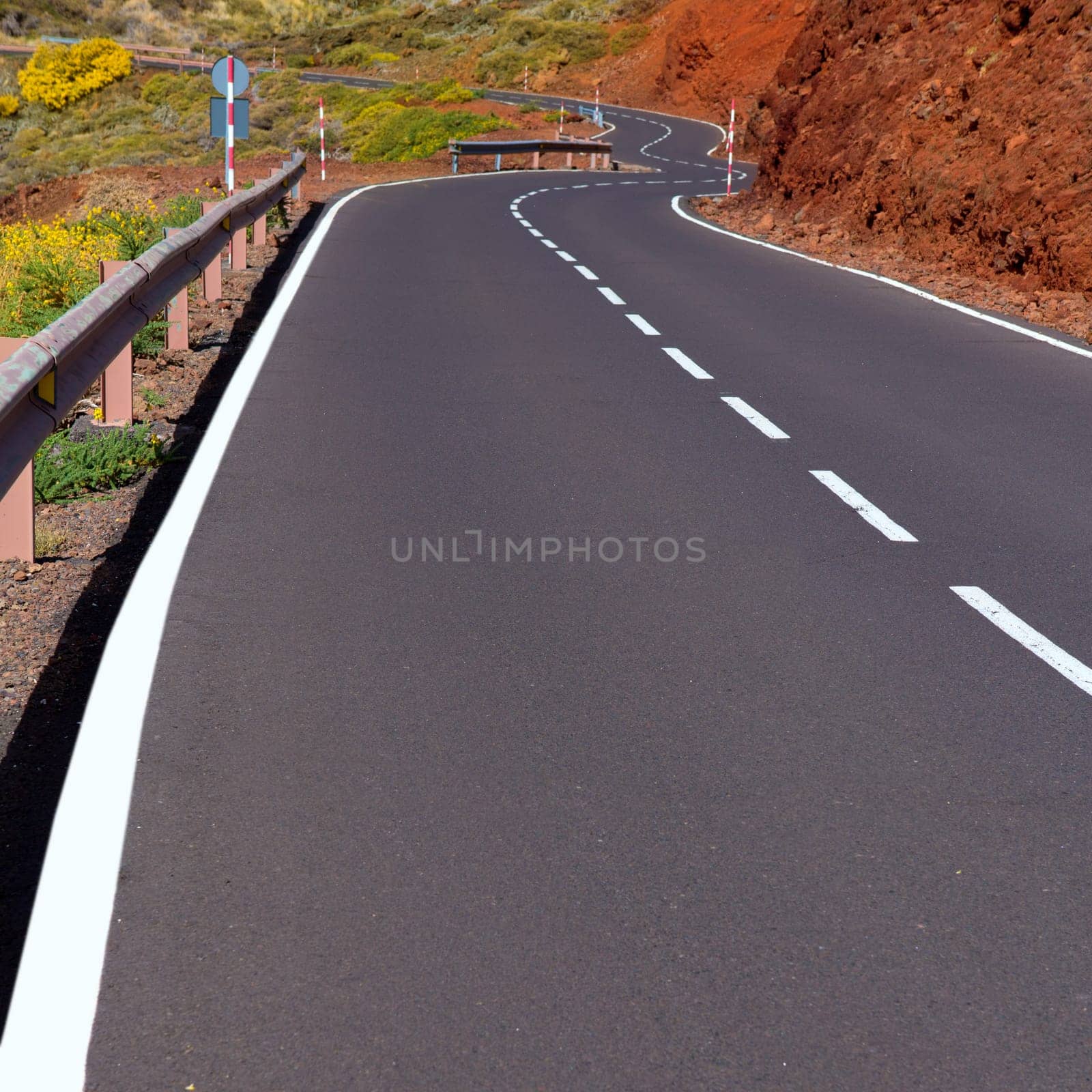 Canary Islands winding road curves in red mountain