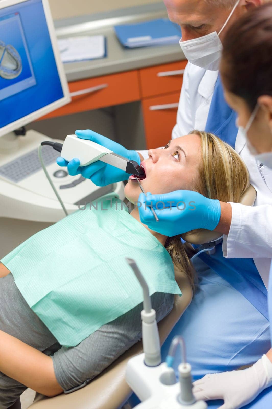 Scared patient at dentist office have teeth checkup stomatology