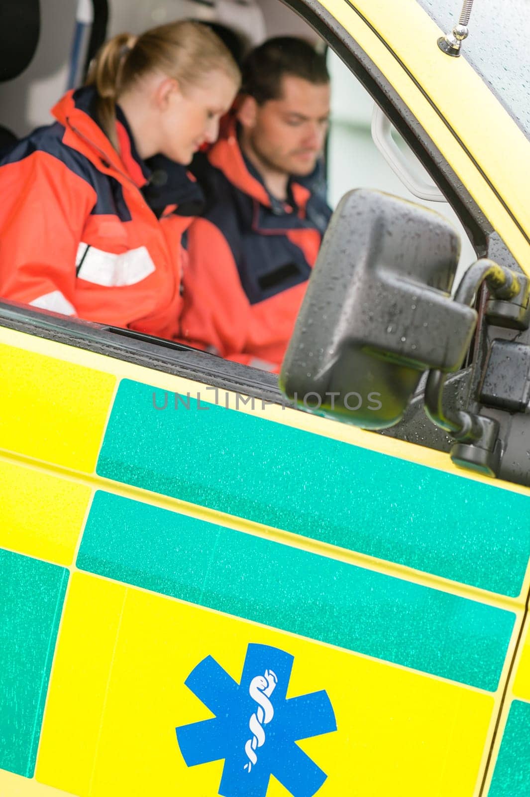 Emergency ambulance car paramedics sitting medical work female doctor