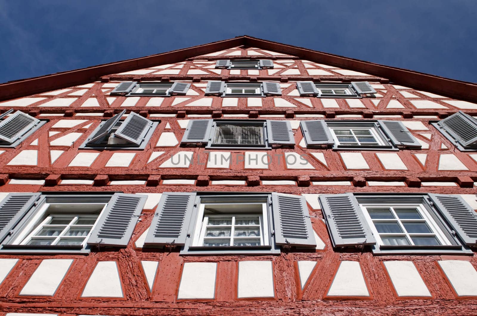 Half-timbered house from a frog's eye view with blue sky