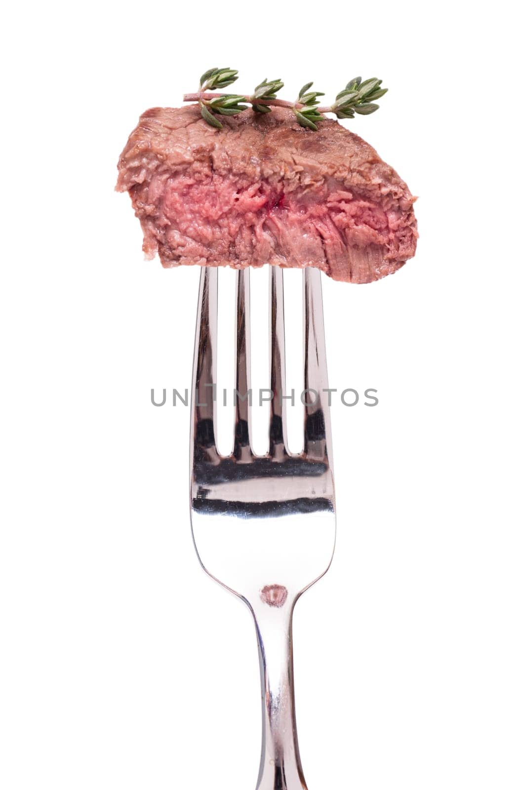 Beef tenderloin with thyme on a fork