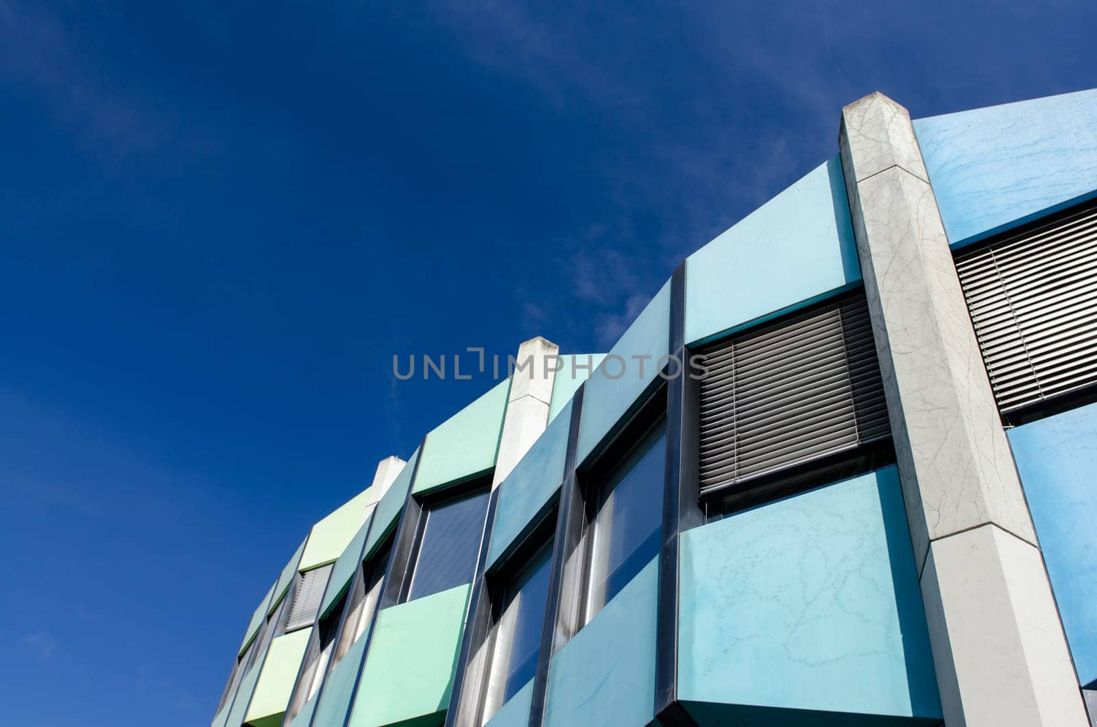 Colorful futuristic building against blue sky