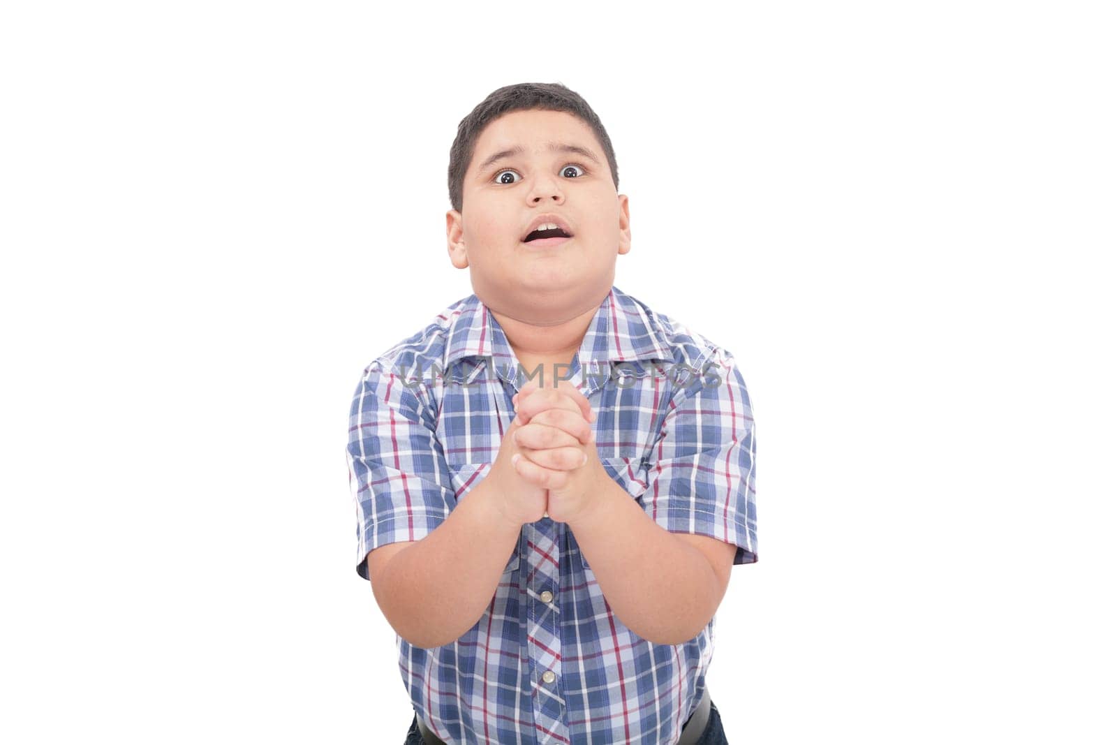 Shocked 10 year old boy trying to defend himself isolated on white