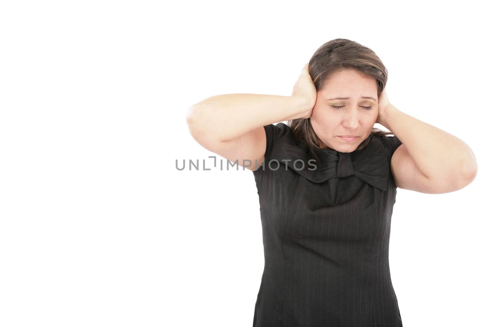 Stressed young woman covering his ears, grimacing and gesturing stop the noise