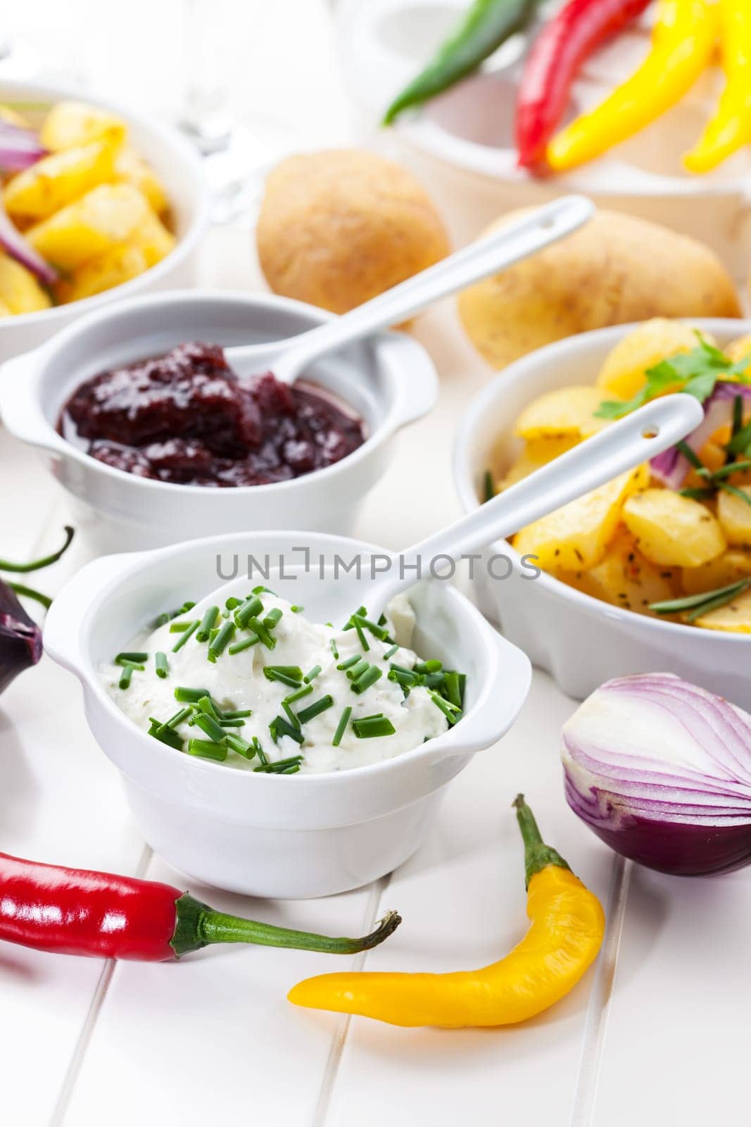 Sour cream and chutney with baked potatoes