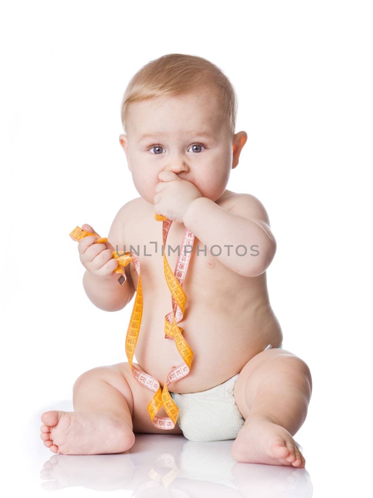 Adorable Baby Boy with a measuring tape.
