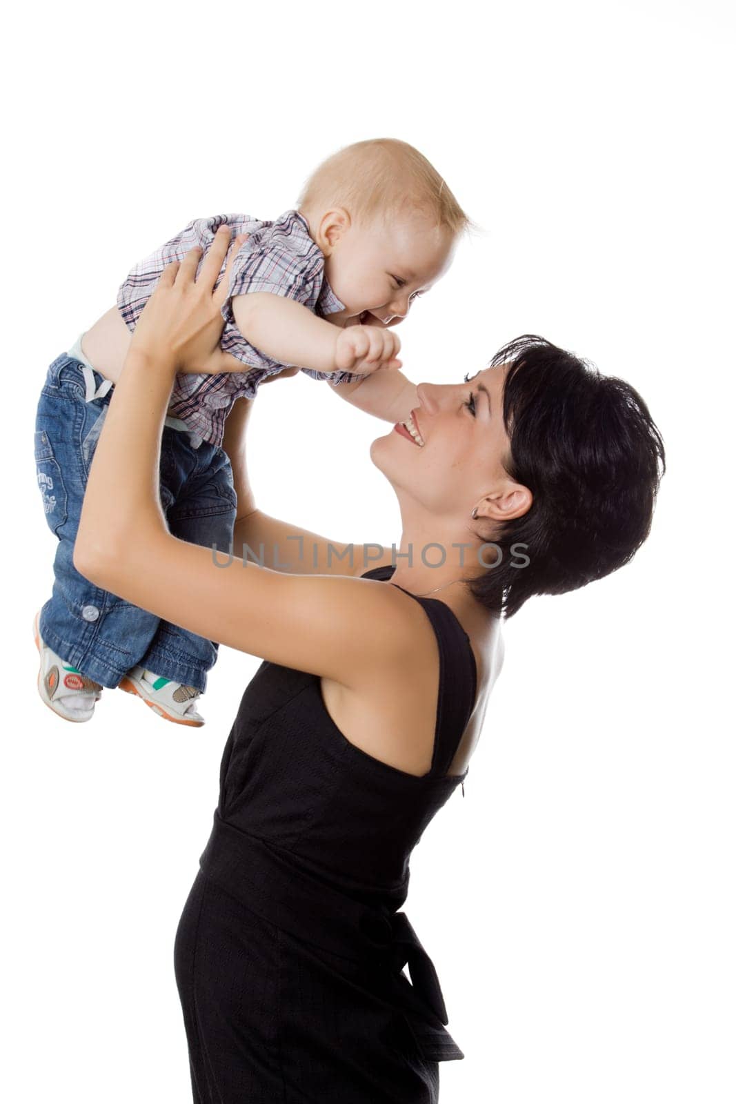 Beautiful happy mather with attractive baby boy on white. Portrait of  baby and his mother.