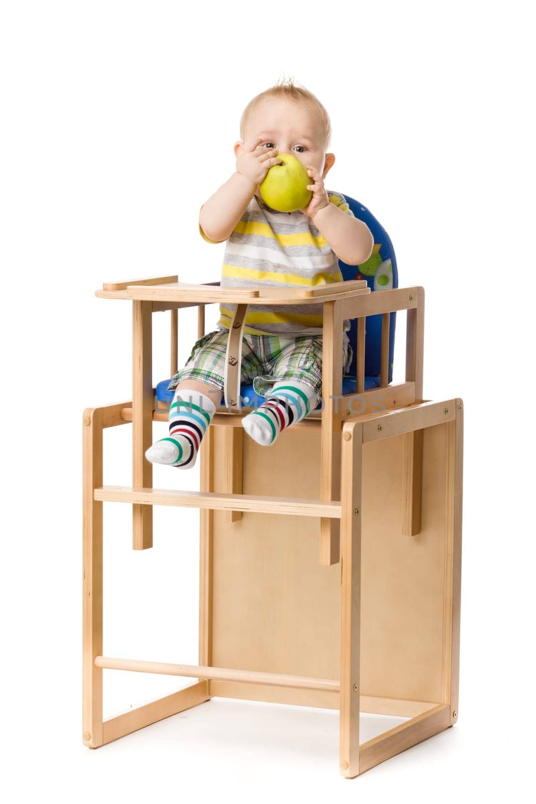 Baby sitting in highchair.