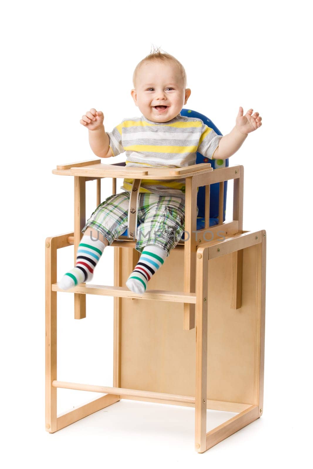 Baby sitting in highchair.