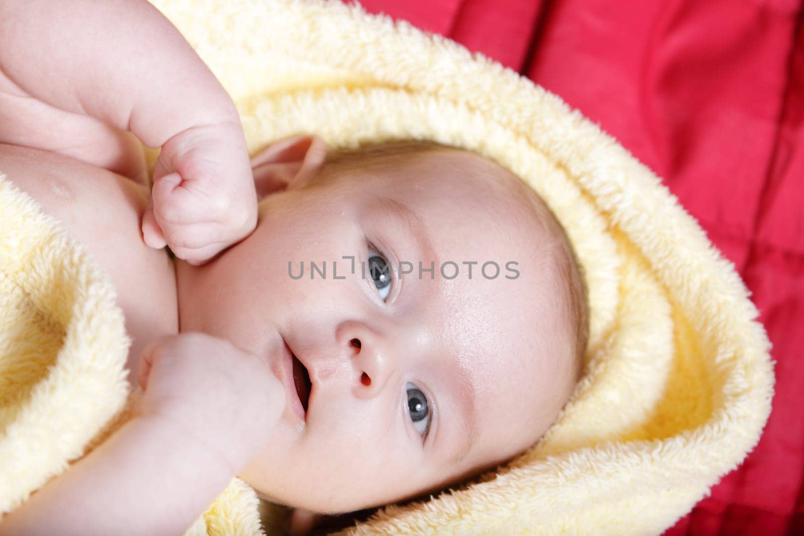 Newborn - close-up focus baby boy with yelow blanket